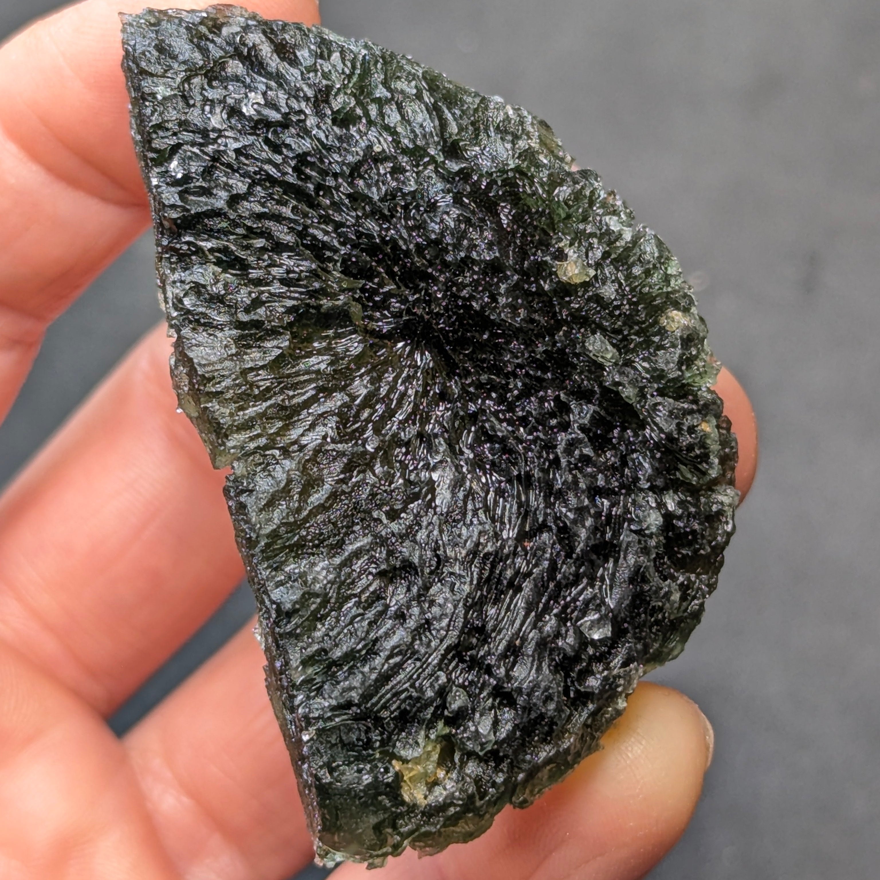 Natural moldavite from Krasejovka, 41 g half-disc - front view, vice versa.