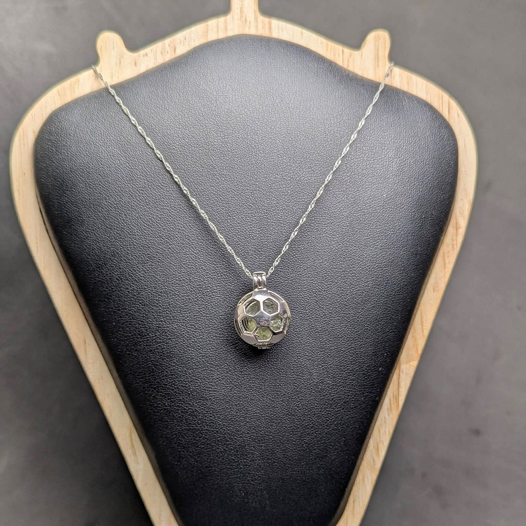Ag 925 sterling silver necklace with natural light green Brusná 4.37 g moldavite in silver cage pendant  - front view, black background.
