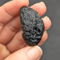 Natural Moldavite from the Něchov locality with deep plastic sculpture, pronounced grooves, dark olive green translucency and authentic natural relief. Weight 8.57 g - front view.