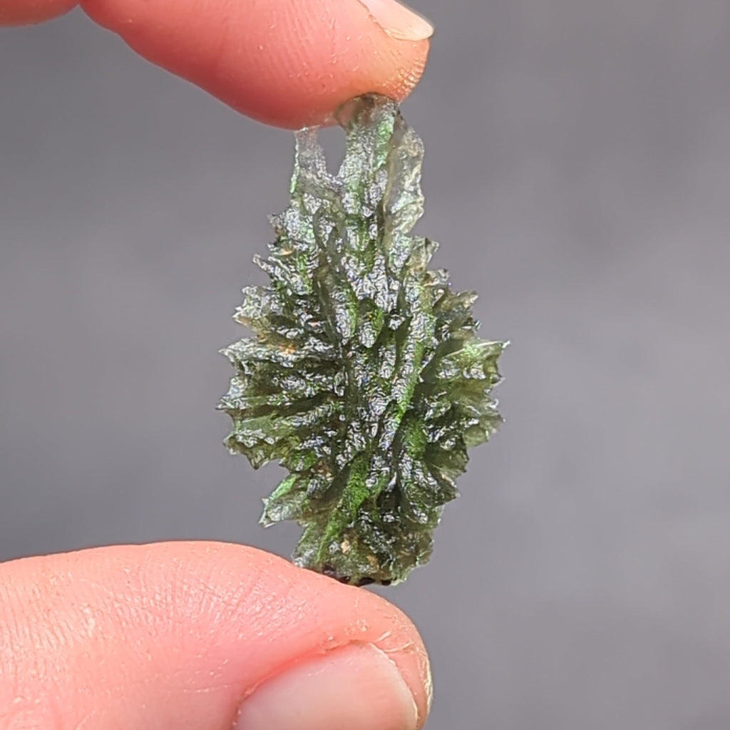 Natural Moldavite from the Besednice Ježkovna locality with sharp hedgehog sculpture, pronounced spikes and authentic natural relief. Weight 2.35 g - back side
