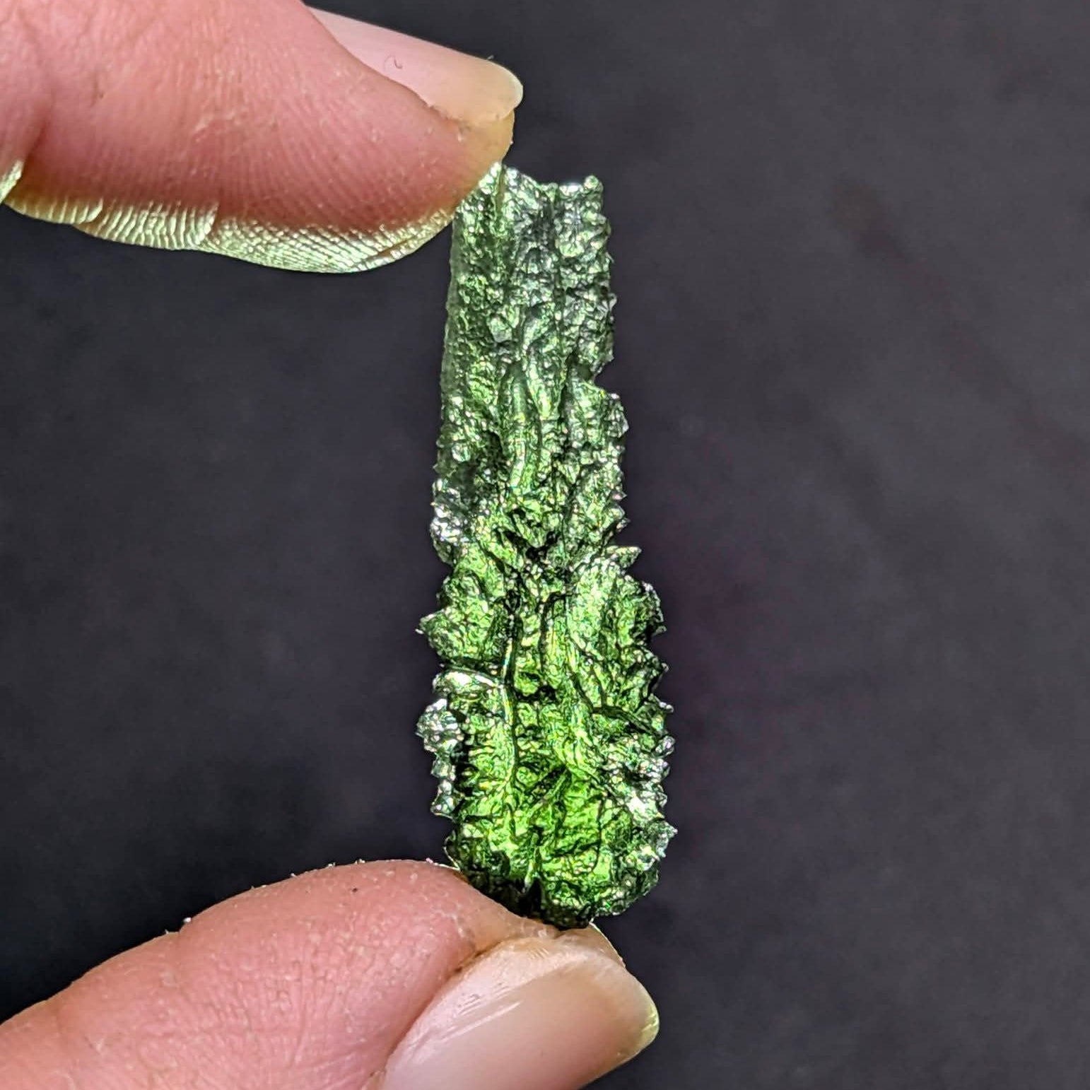Moldavite Olešnice 1.73g - drop shape, smooth neon green translucent top, dense dark sculpture below - backlight