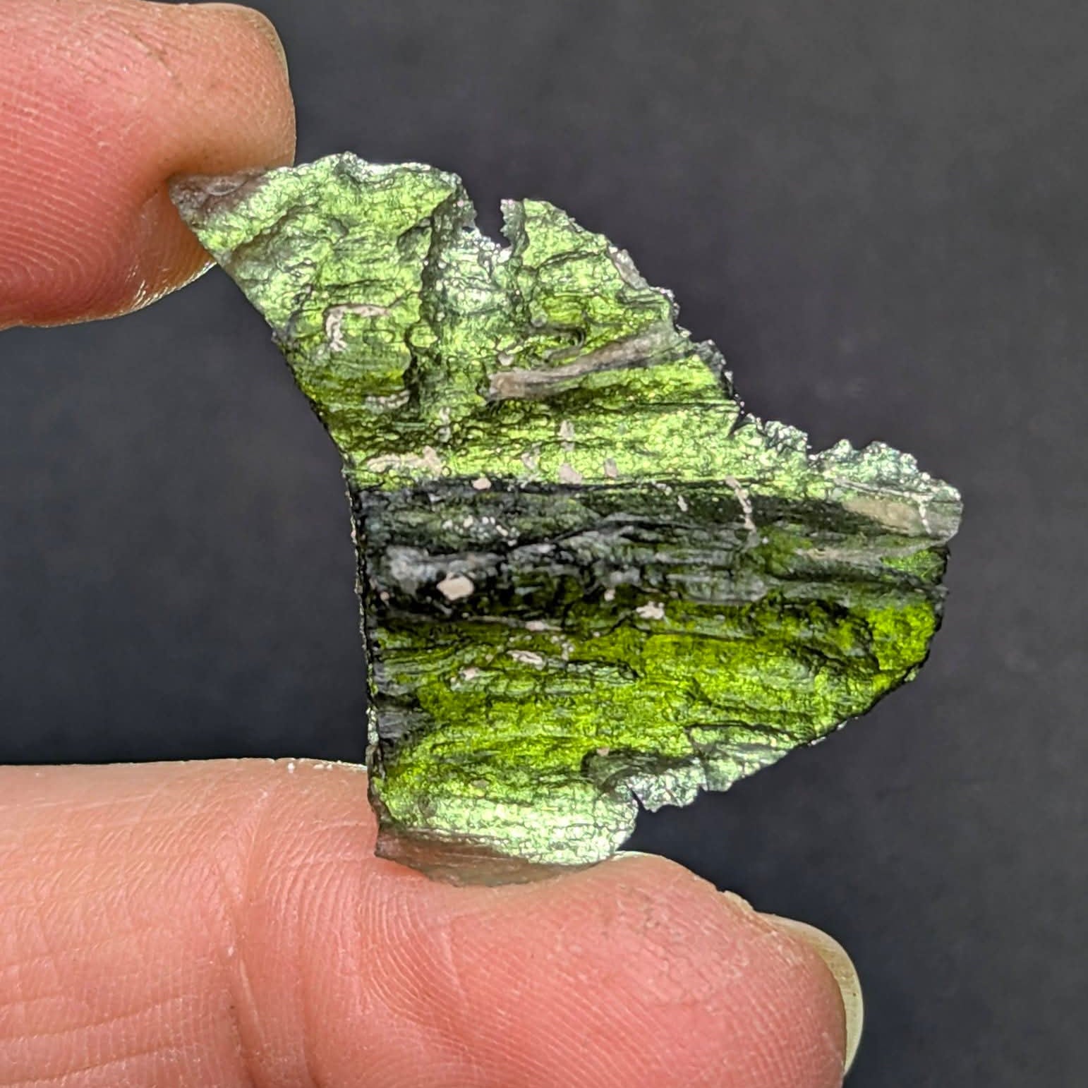 Natural Brusná 4.29 g - moldavite with rare layered sculpture, olive-green translucent glass and distinctive textured surface, backlight.