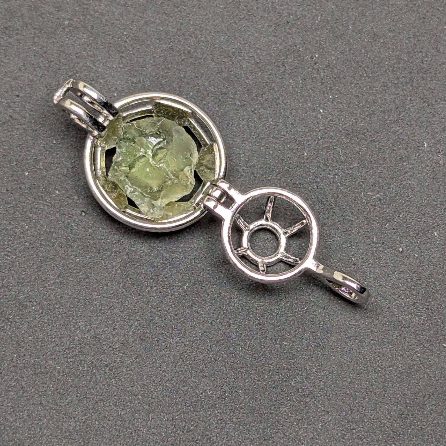 Ag 925 sterling silver necklace with natural light green Brusná 4.37 g moldavite in silver cage pendant  - sample of an open pendant.